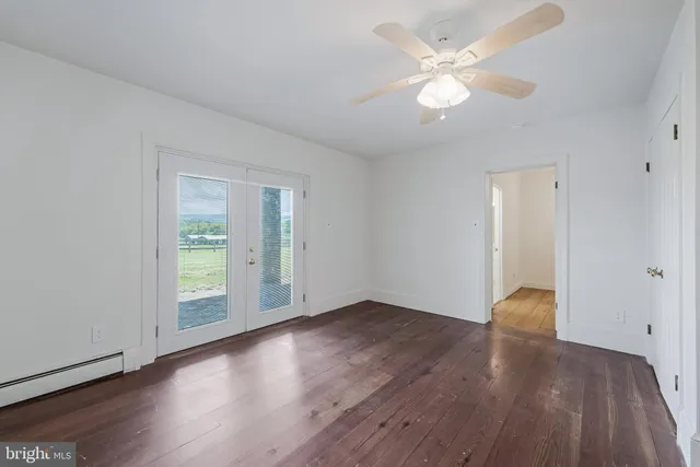 a view of swimming pool and trees in the background