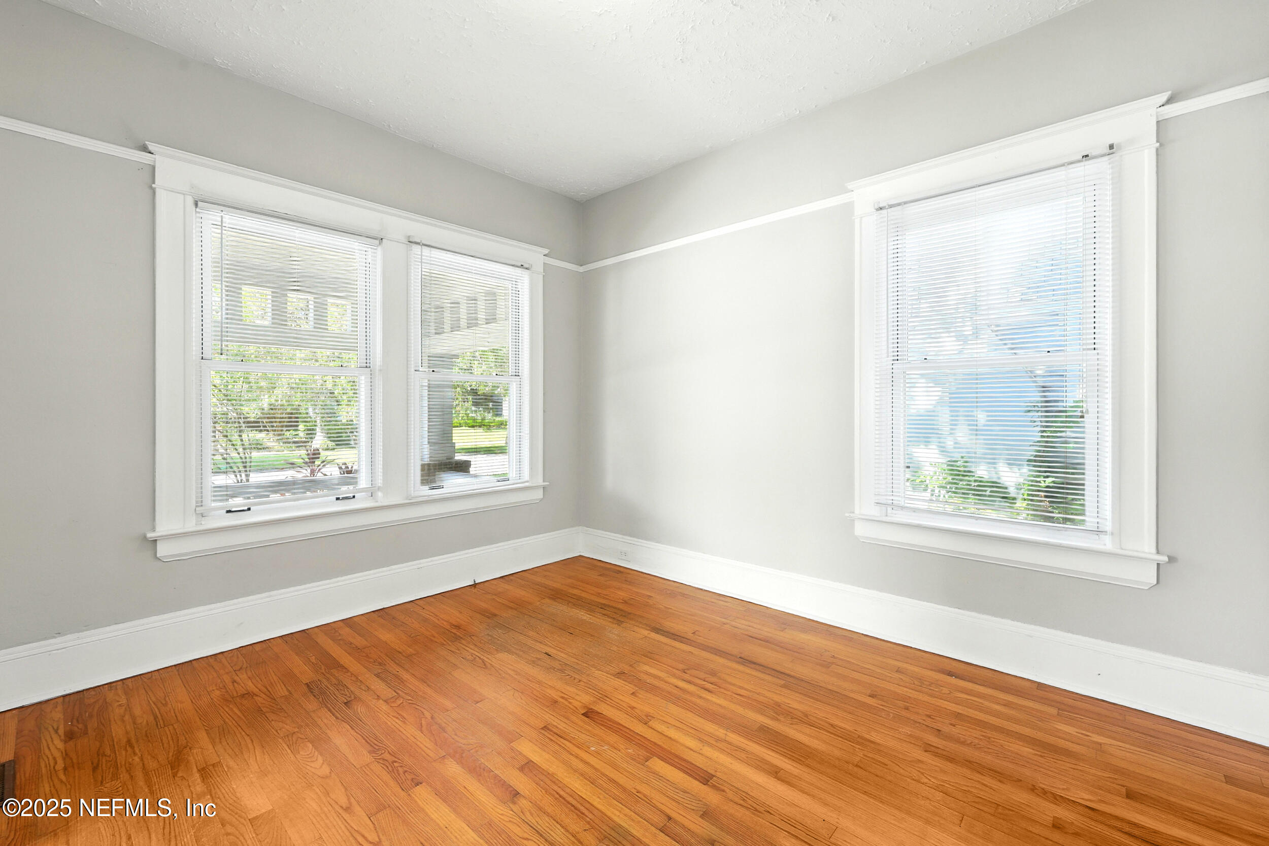 2805 Post Street Jacksonville, FL 32205 - Photo 12 of 23 a view of an empty room with wooden floor and a window