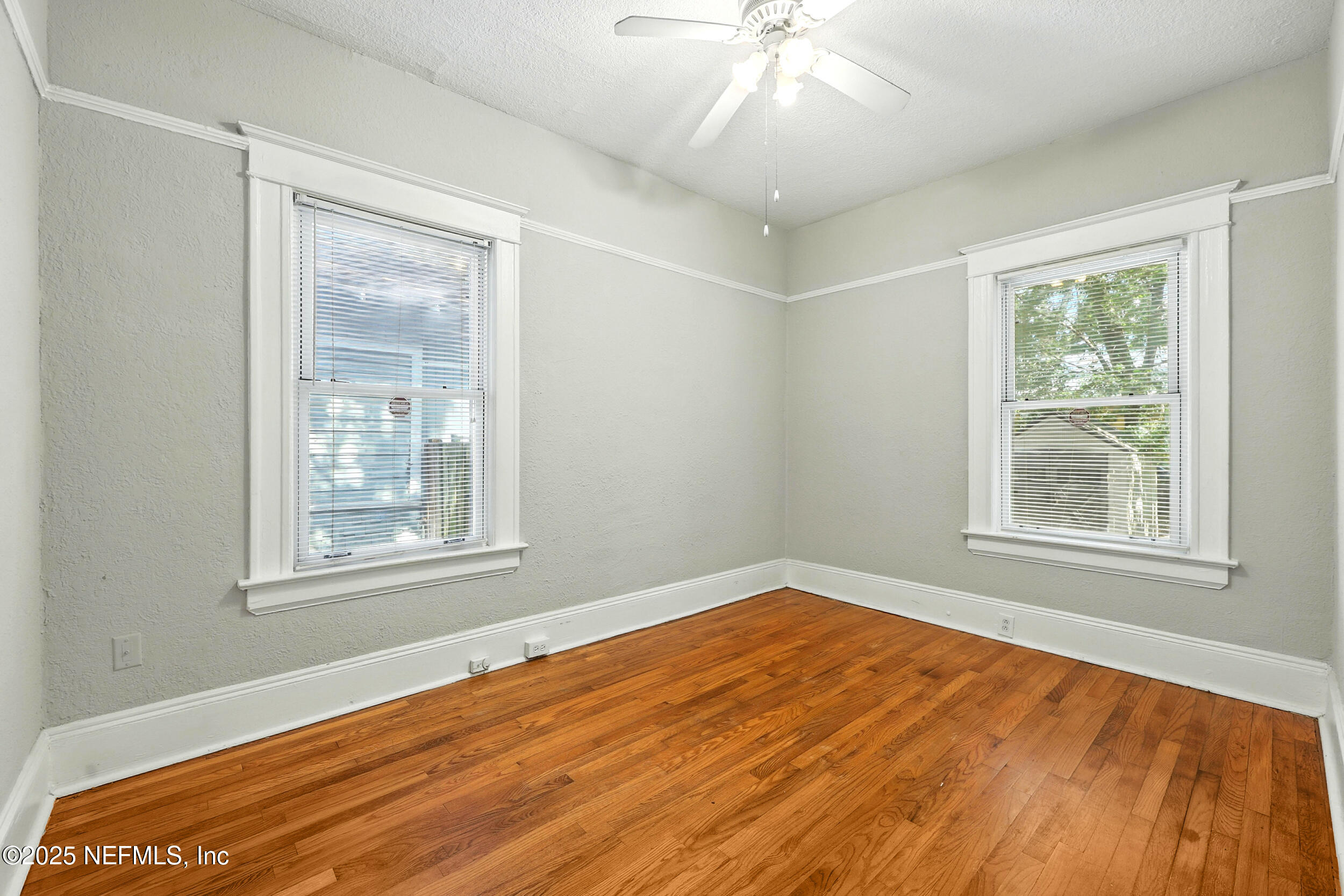 2805 Post Street Jacksonville, FL 32205 - Photo 13 of 23 a view of an empty room with wooden floor and a window