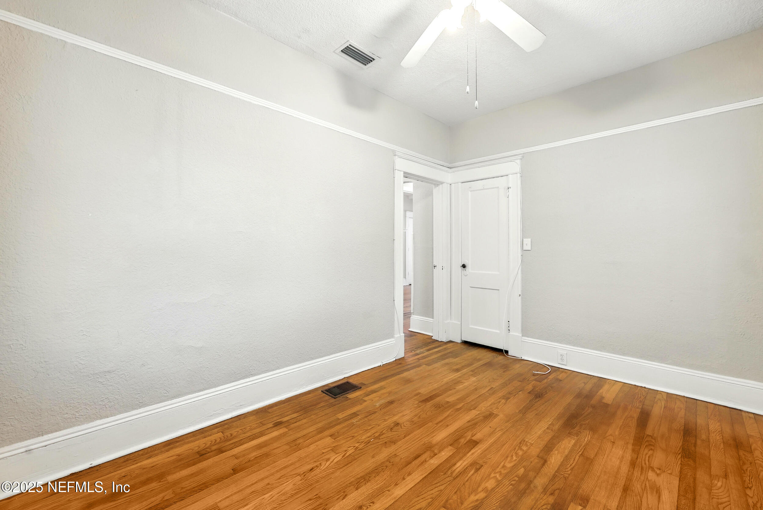 2805 Post Street Jacksonville, FL 32205 - Photo 14 of 23 a view of an empty room with wooden floor