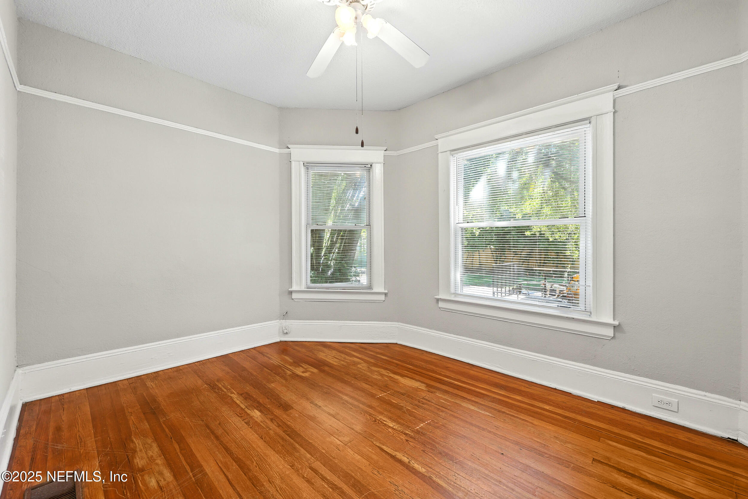 2805 Post Street Jacksonville, FL 32205 - Photo 15 of 23 an empty room with wooden floor and windows