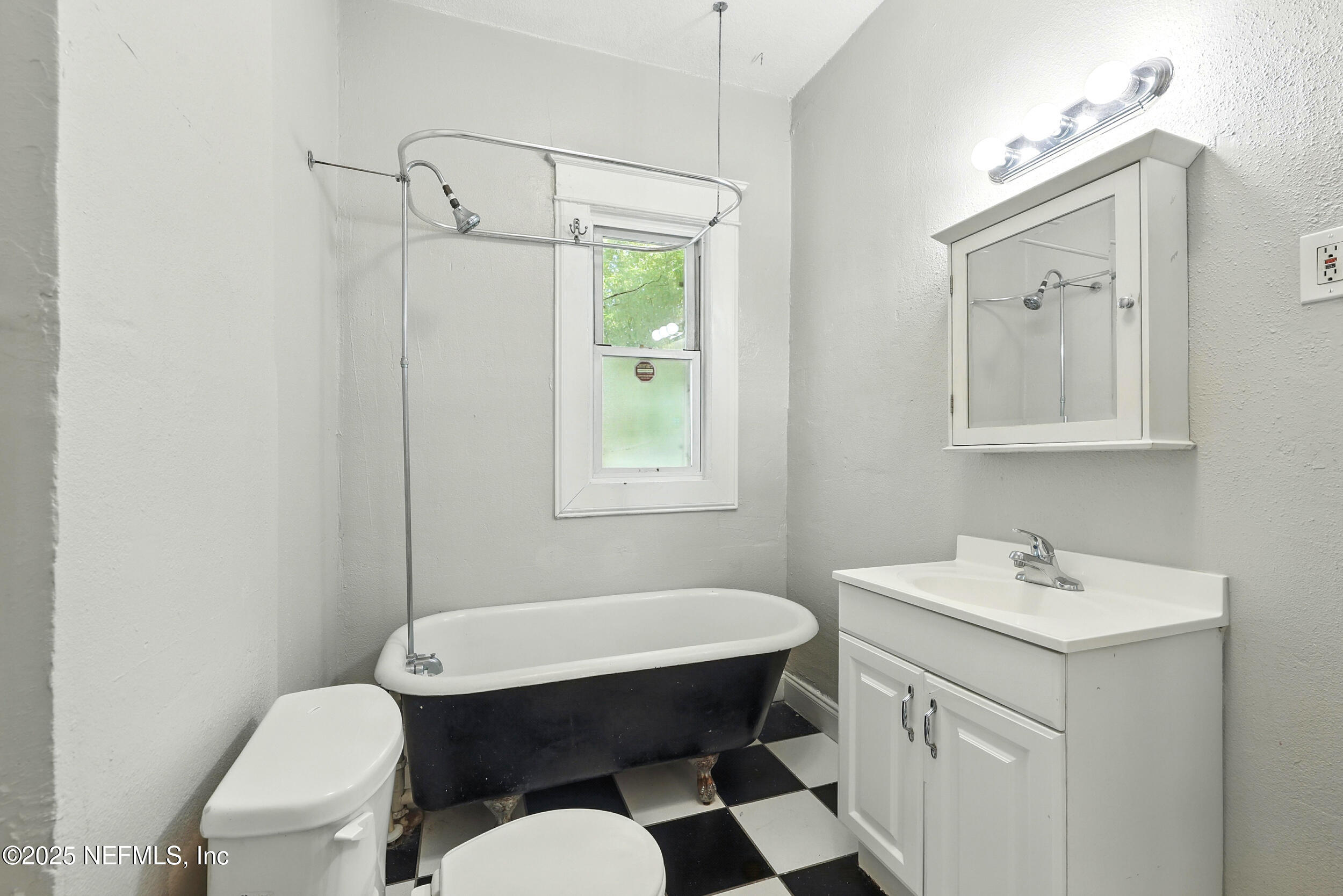 2805 Post Street Jacksonville, FL 32205 - Photo 17 of 23 a bathroom with a sink vanity mirror and toilet