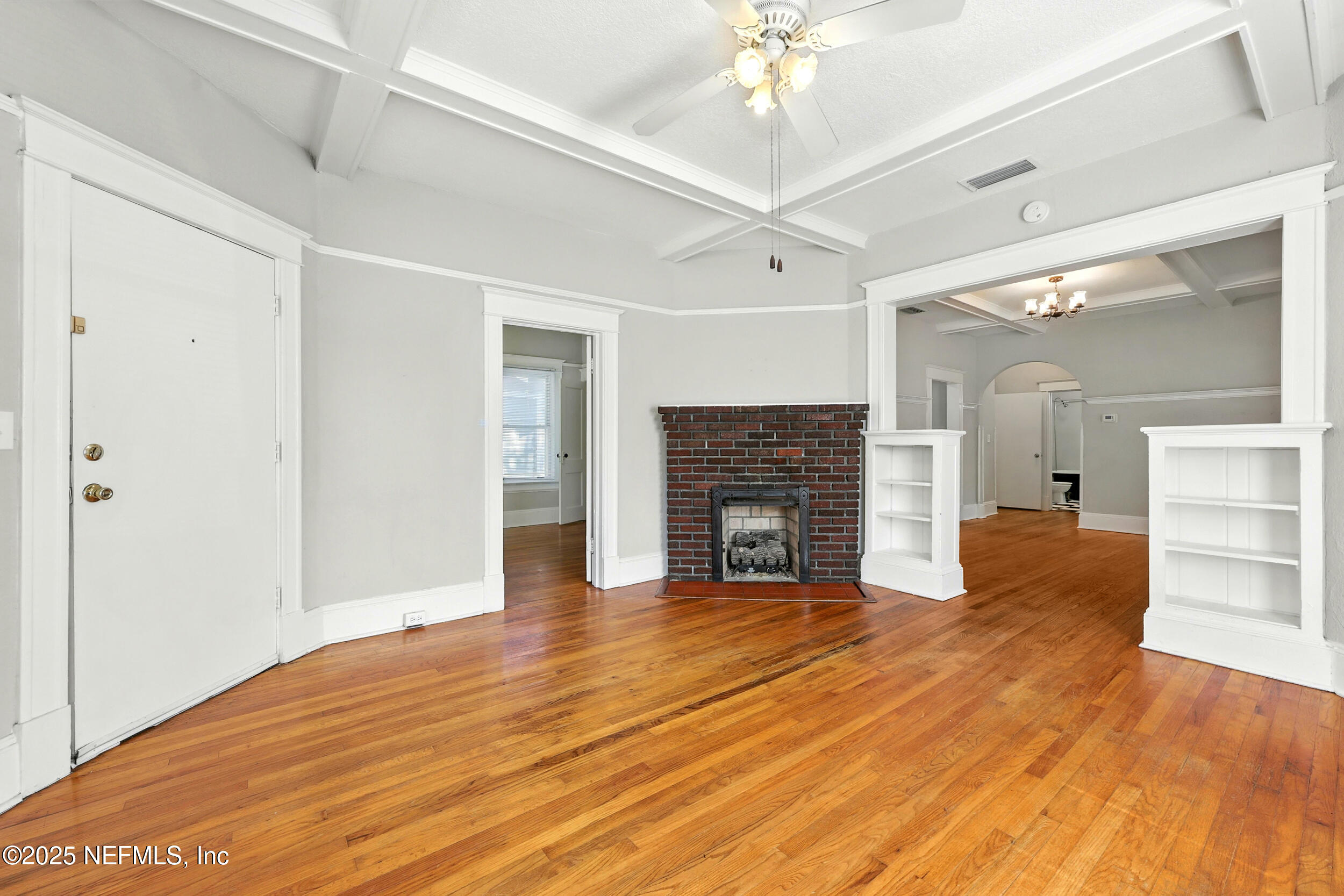 2805 Post Street Jacksonville, FL 32205 - Photo 3 of 23 a view of an empty room with wooden floor and fireplace