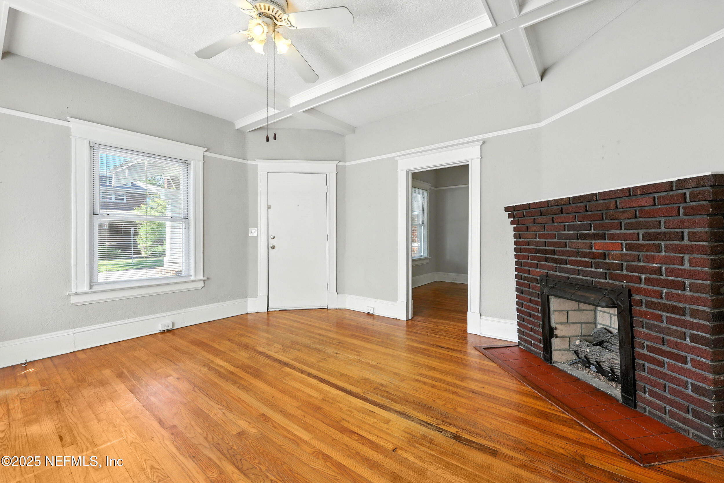 2805 Post Street Jacksonville, FL 32205 - Photo 4 of 23 a view of empty room with wooden floor and fan