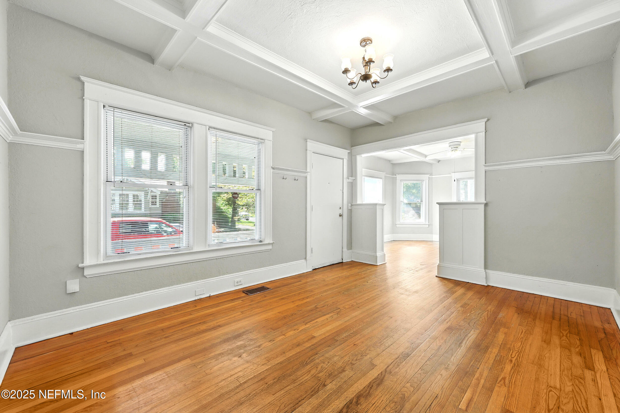 2805 Post Street Jacksonville, FL 32205 - Photo 6 of 23 wooden floor in an empty room with a window