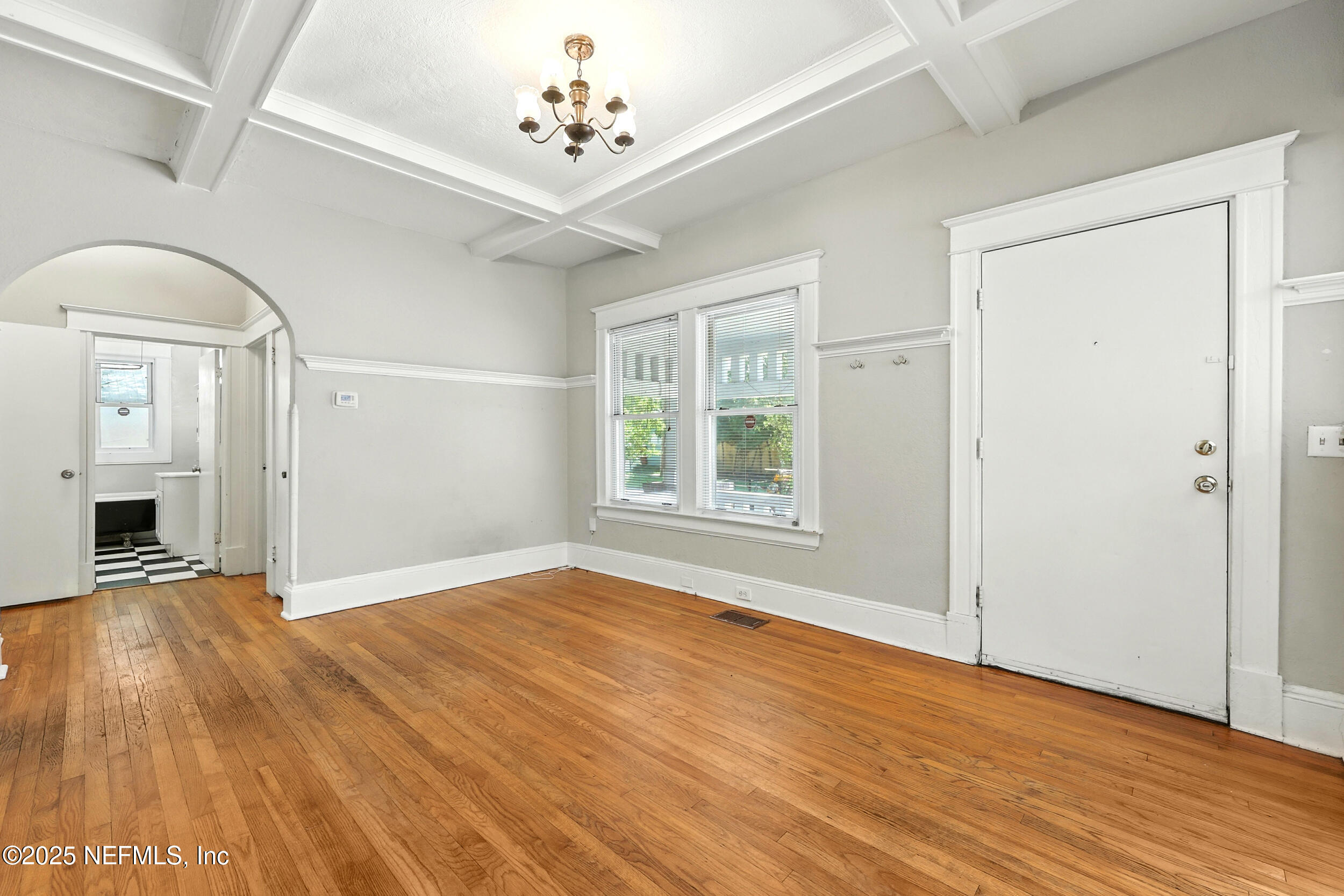 2805 Post Street Jacksonville, FL 32205 - Photo 7 of 23 wooden floor in an empty room with a window