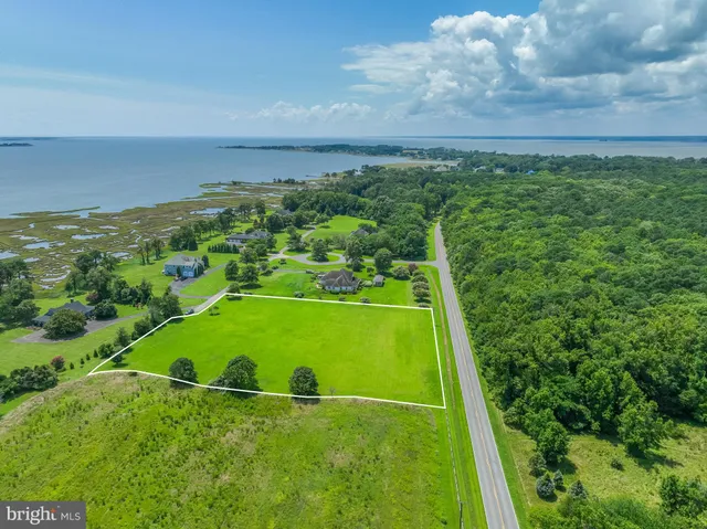 an aerial view of a golf course with a swimming pool