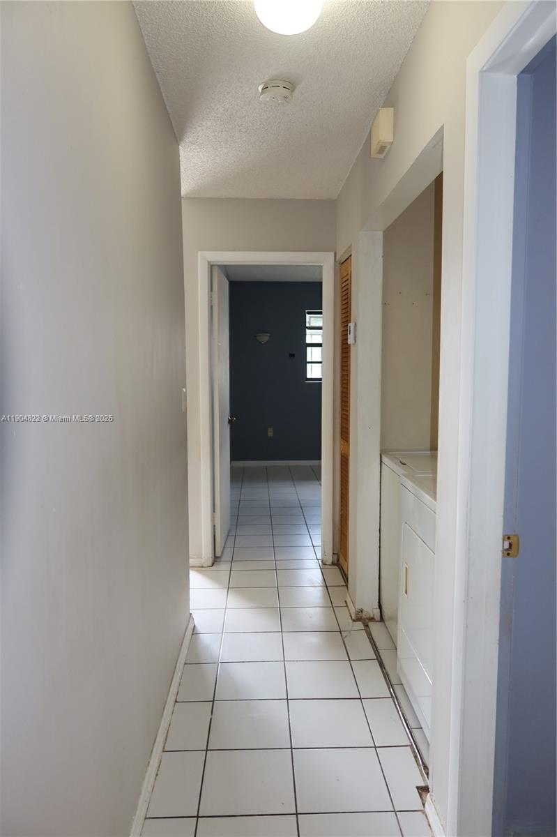 12059 Southwest 10th Street, Unit 201 Miami, FL 33184 - Photo 7 of 17 a view of a hallway