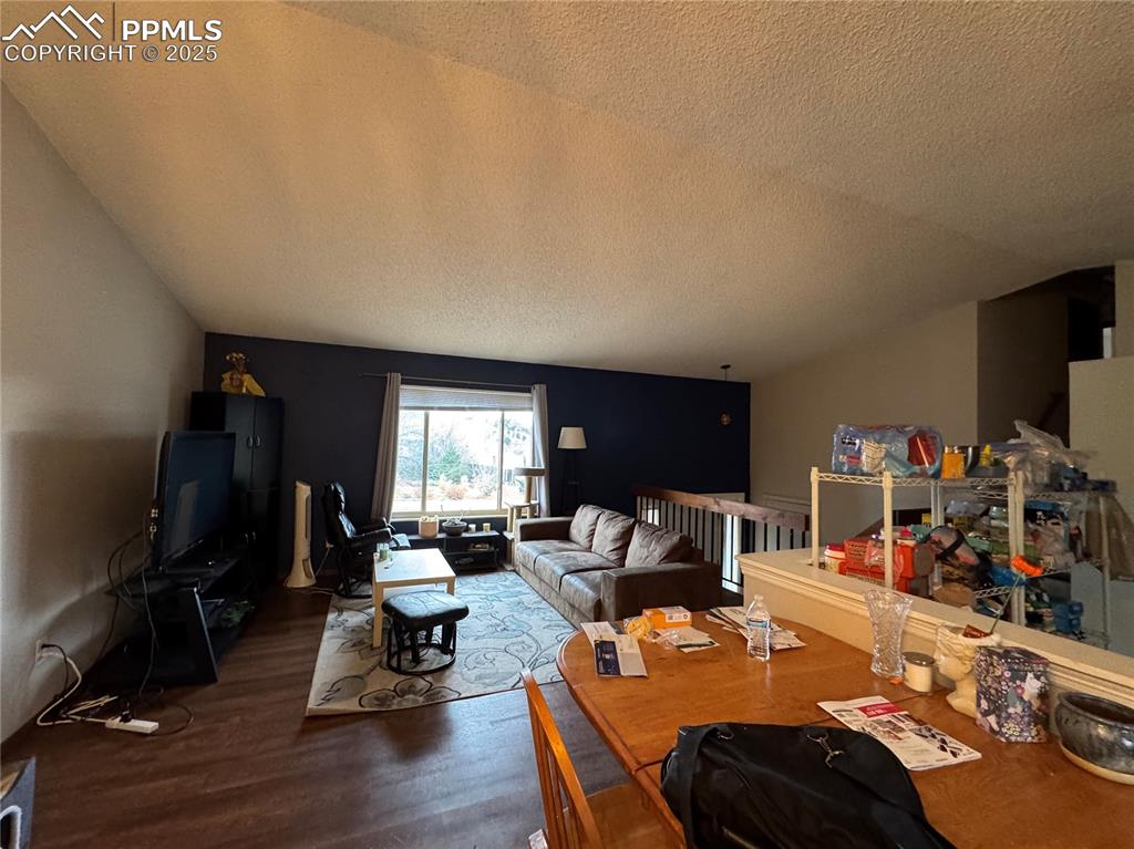 2135 Westmoreland Road Colorado Springs, CO 80907 - Photo 6 of 8 a room with furniture a flat screen tv and a window