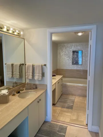 a bathroom with a sink and a mirror