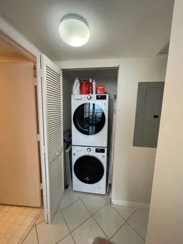 a view of a hallway with washer and dryer