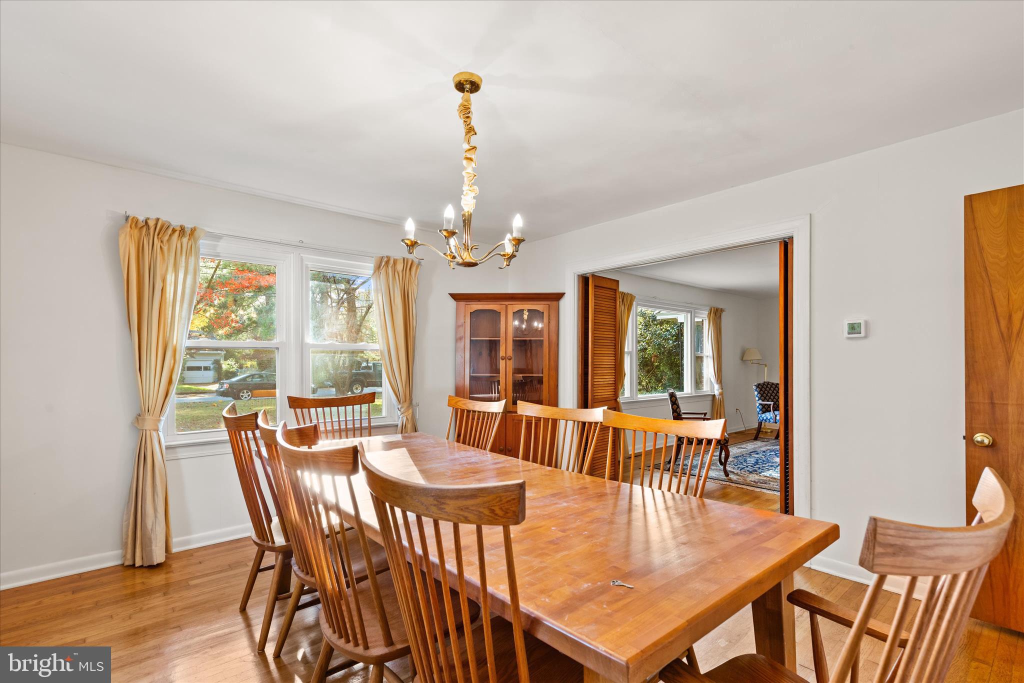 625 Pine Bluff Road Salisbury, MD 21801 - Photo 11 of 37 a view of a dining room with furniture wooden floor and chandelier
