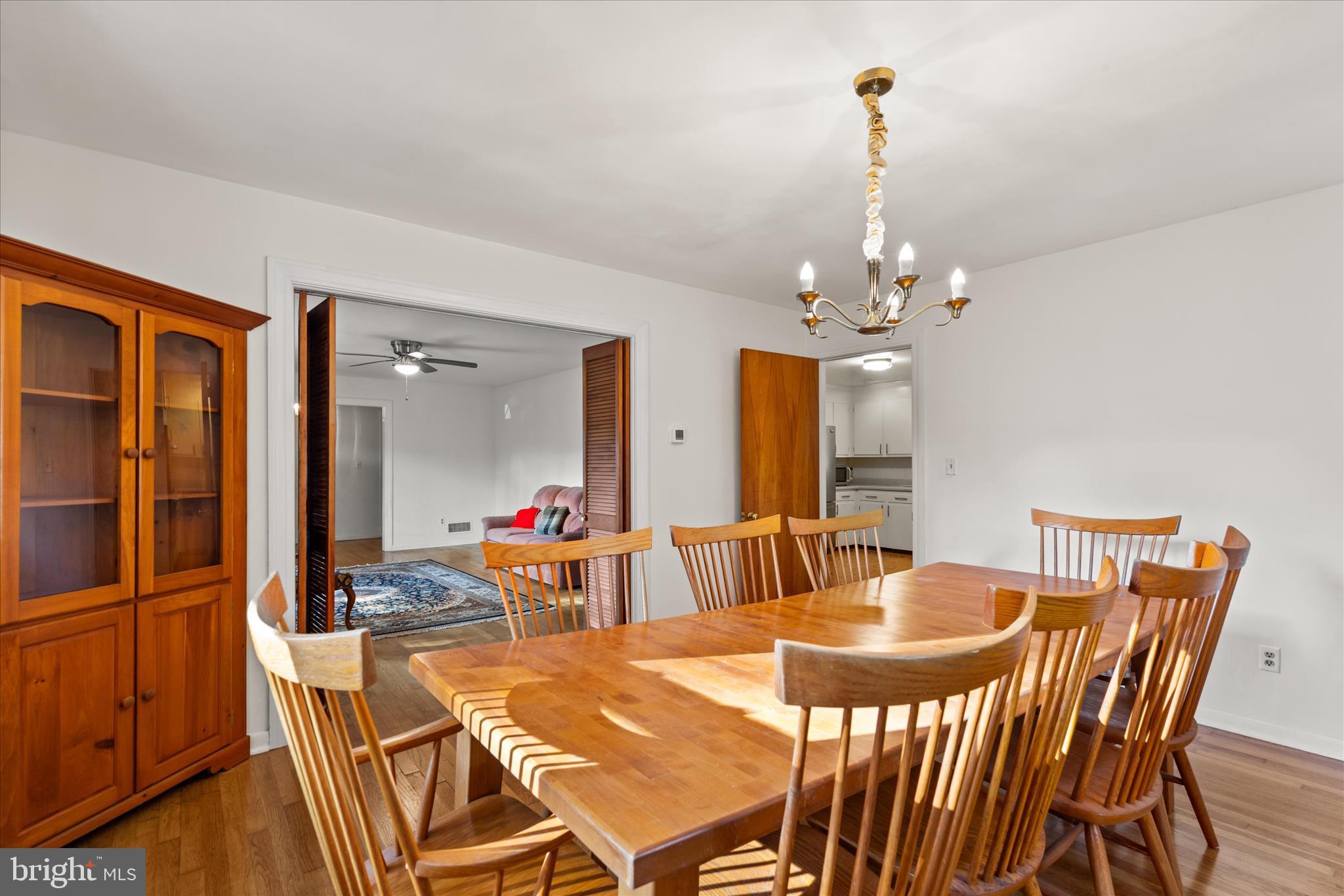 625 Pine Bluff Road Salisbury, MD 21801 - Photo 12 of 37 a dining room with furniture a chandelier and window