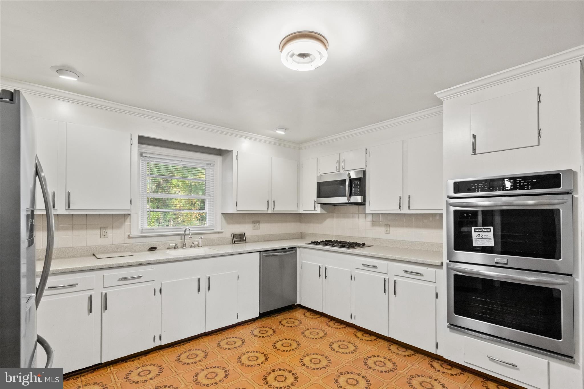 625 Pine Bluff Road Salisbury, MD 21801 - Photo 14 of 37 a kitchen with a sink stove oven and window
