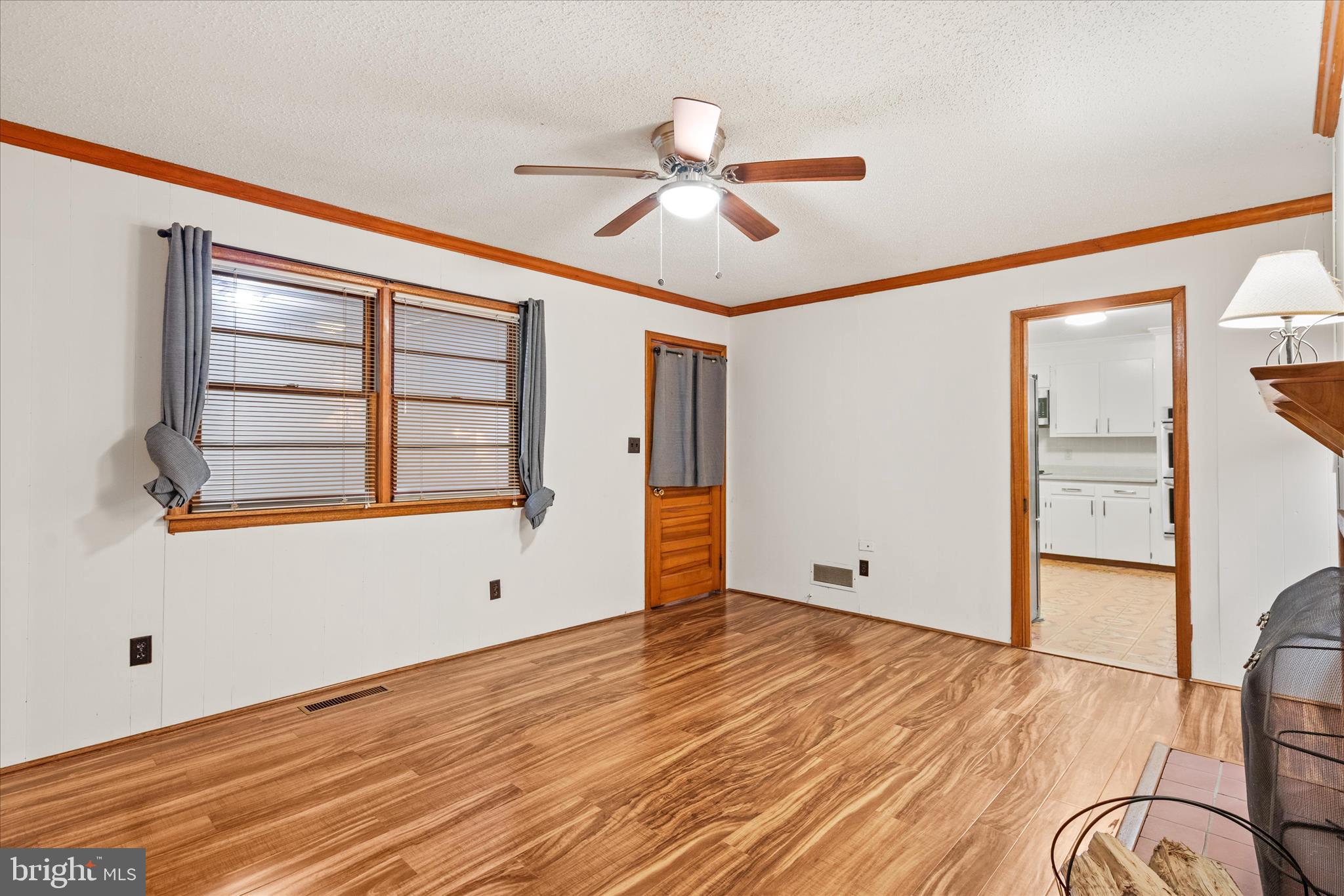 625 Pine Bluff Road Salisbury, MD 21801 - Photo 18 of 37 a view of empty room with wooden floor and fan