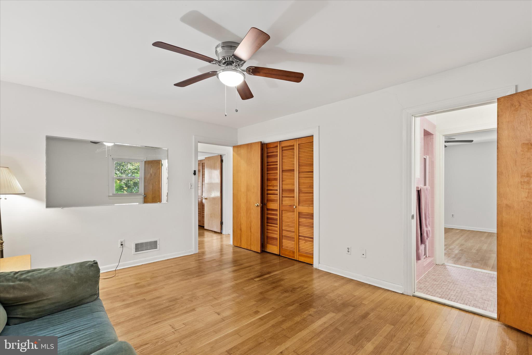 625 Pine Bluff Road Salisbury, MD 21801 - Photo 22 of 37 a view of a livingroom with a ceiling fan and wooden floor