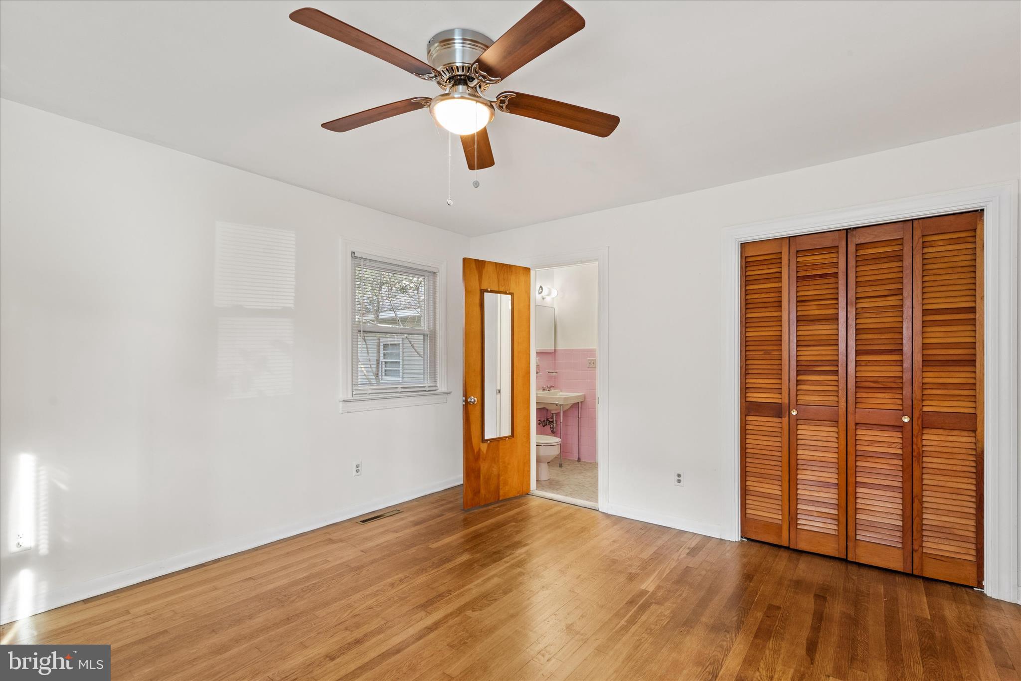 625 Pine Bluff Road Salisbury, MD 21801 - Photo 24 of 37 wooden floor in an empty room with a window