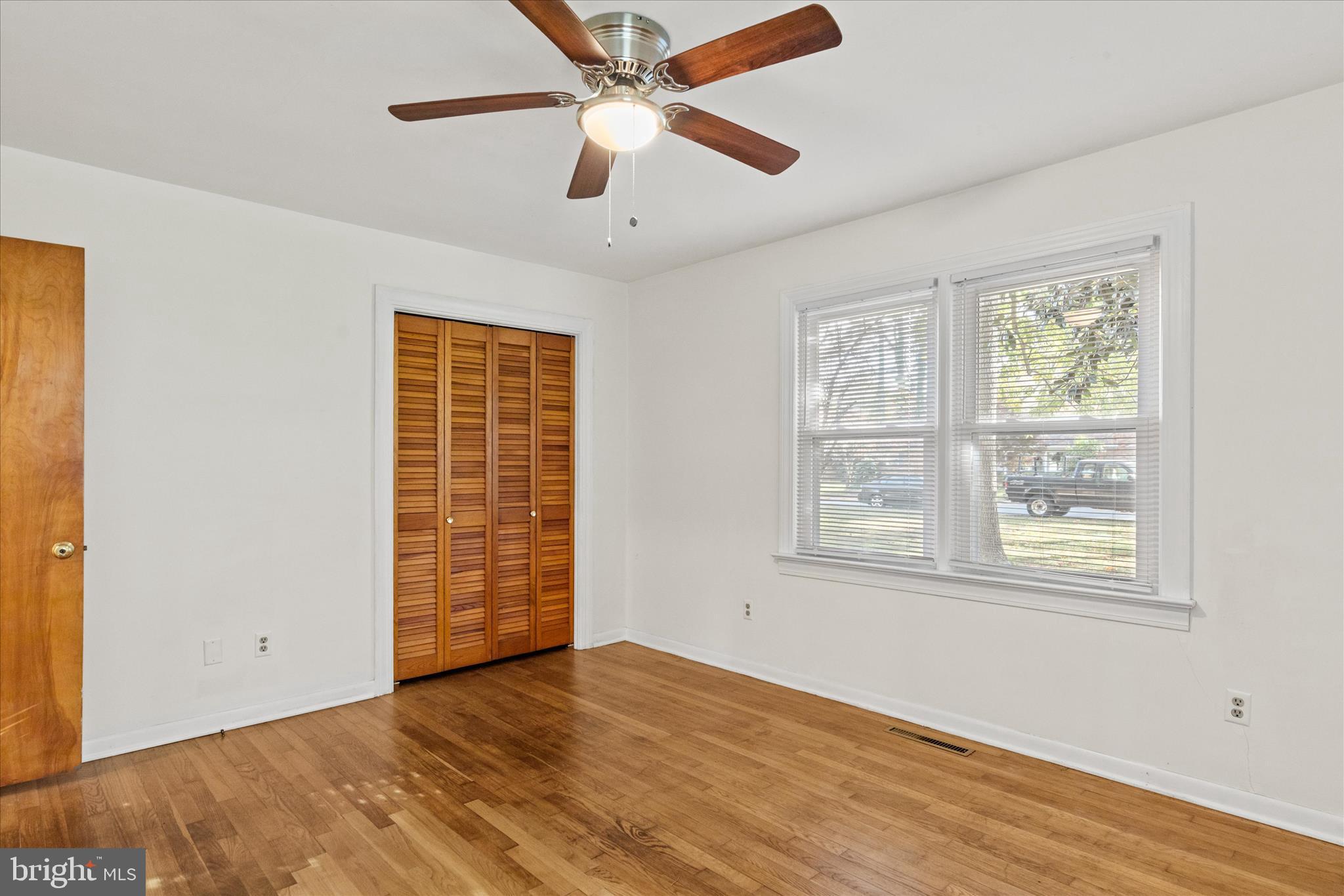 625 Pine Bluff Road Salisbury, MD 21801 - Photo 28 of 37 a view of an empty room with a window and wooden floor