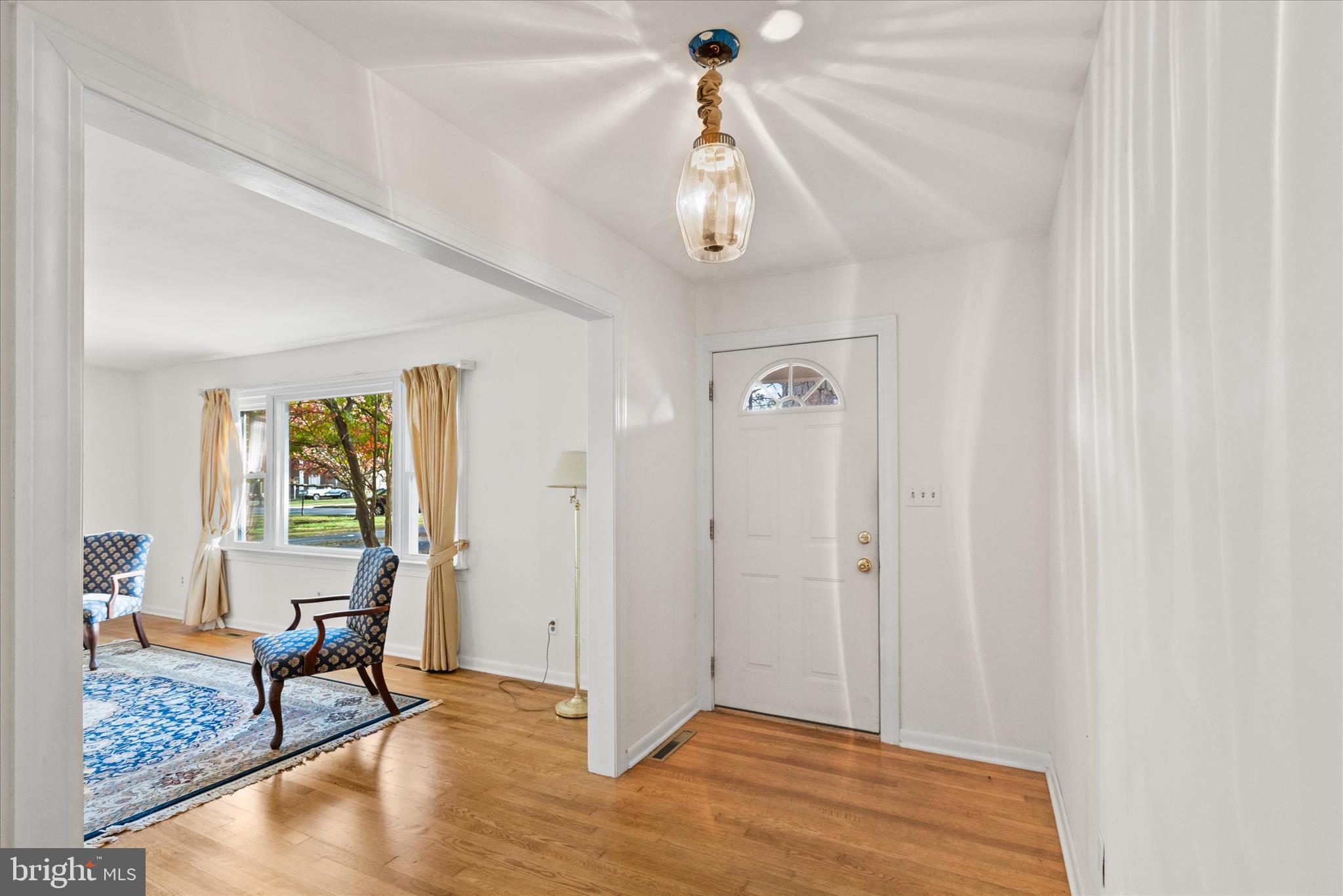 625 Pine Bluff Road Salisbury, MD 21801 - Photo 6 of 37 a view of a livingroom with wooden floor and a window
