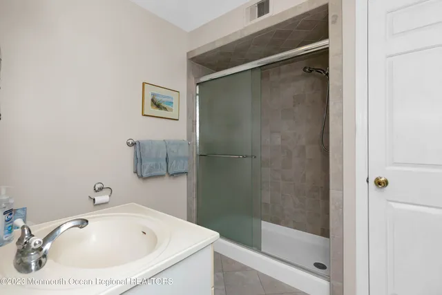 a bathroom with a tub and shower