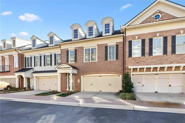 a front view of a house with a garage