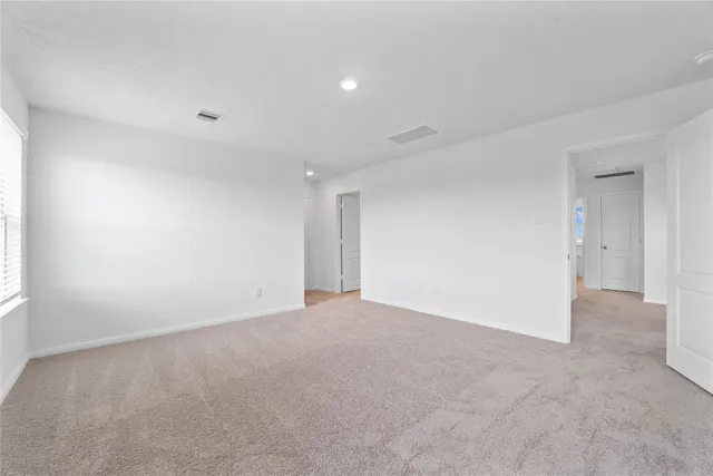 a bathroom with a double vanity sink mirror and bathtub