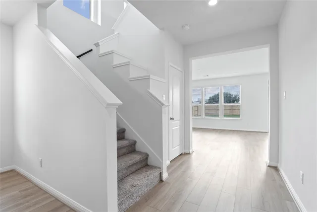 a bathroom with a sink toilet and a mirror
