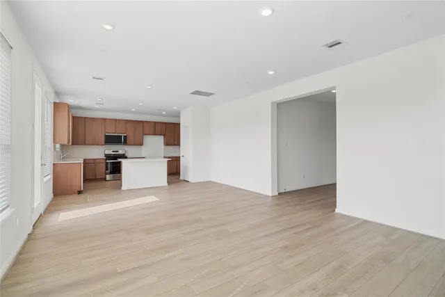 a view of a kitchen with a sink cabinets and a window