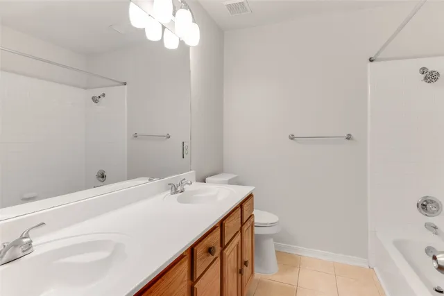 a view of house with backyard and sitting area