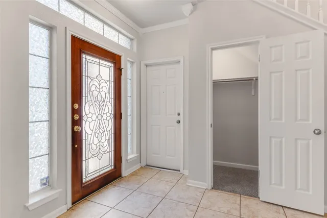 a view of an entryway with wooden floor