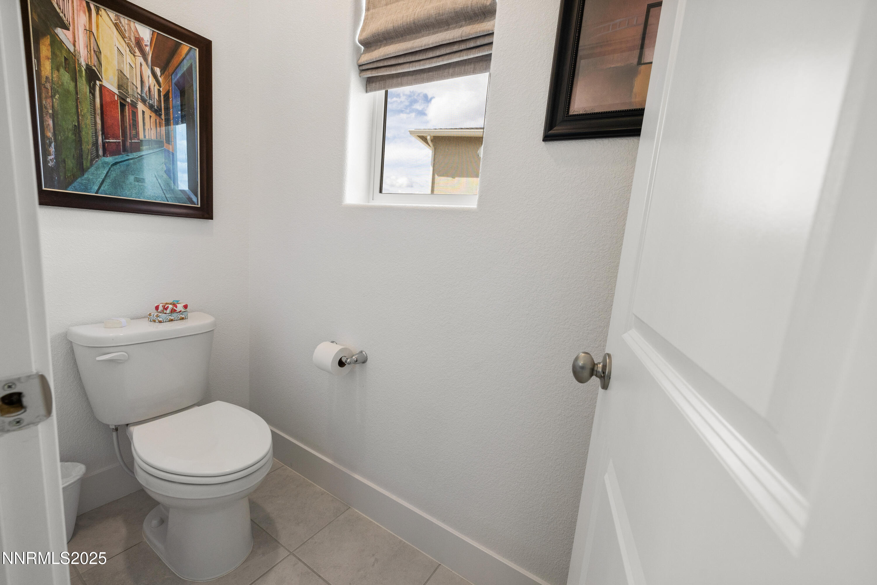 3604 Pulsar Lane, Unit 3 Carson City, NV 89705 - Photo 24 of 59 a white toilet sitting next to a white sink and vanity