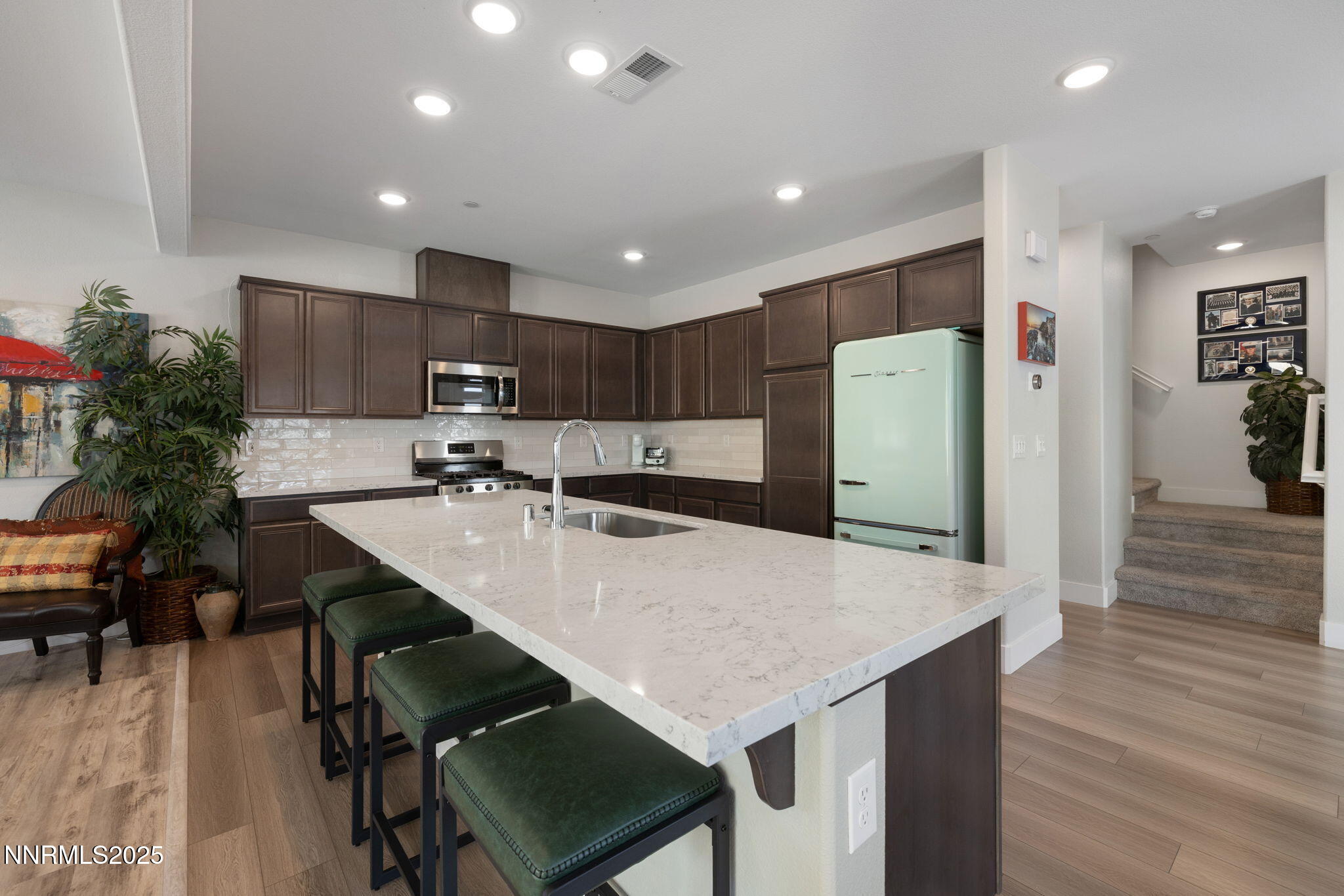 3604 Pulsar Lane, Unit 3 Carson City, NV 89705 - Photo 34 of 59 a kitchen with refrigerator and a table