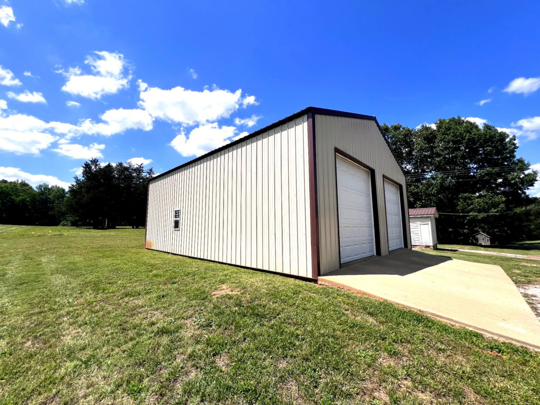 1133 Culps Bend Road Clifton, TN 38425 - Photo 22 of 51 a view of a house with backyard and trees around