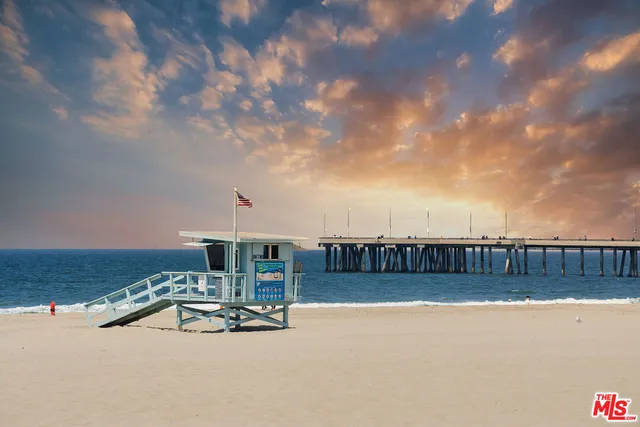 a view of swimming pool with outdoor seating and city view