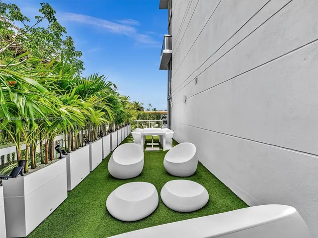 a bathroom with a toilet sink and garden view