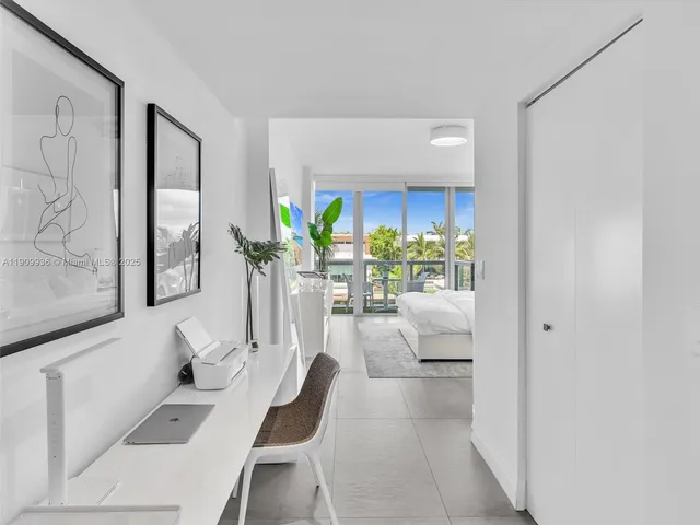 a view of living room filled with furniture and a potted plant