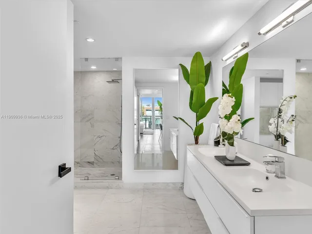 a bathroom with a sink a vanity and a mirror