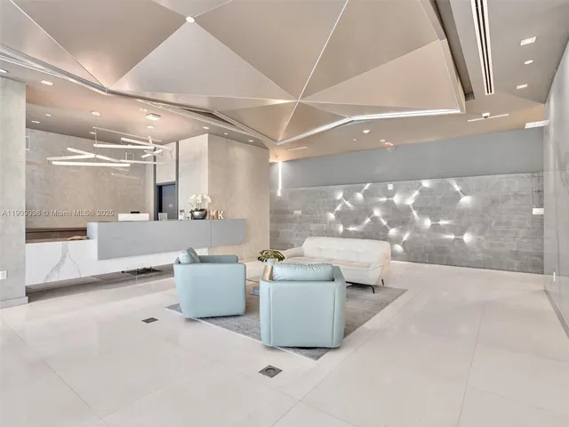 a lobby with furniture and window