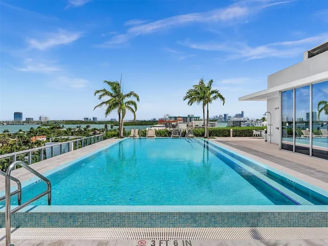a view of a swimming pool with a chair