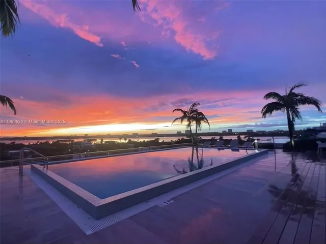a view of swimming pool with outdoor seating