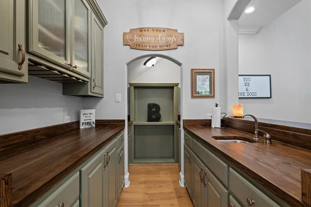 a kitchen with a sink cabinets and window