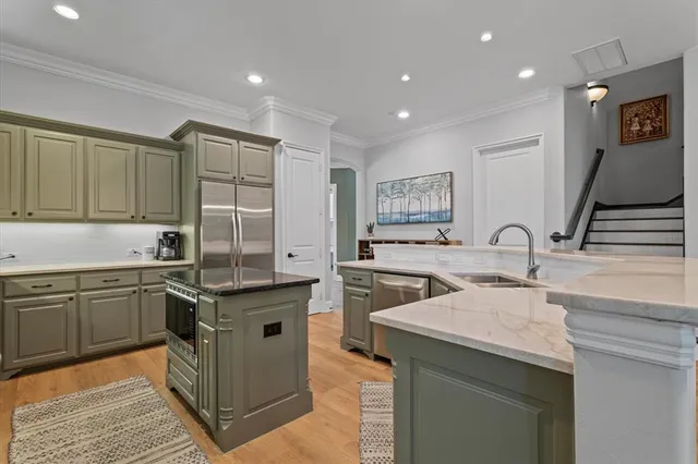 a kitchen with a sink and cabinets