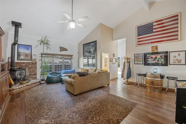 a view of a workspace with furniture and wooden floor