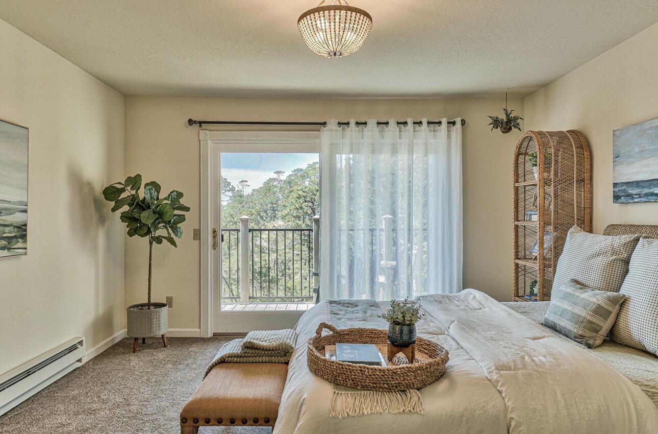 250 Forest Ridge Road, Unit 64 Monterey, CA 93940 - Photo 18 of 35 a bedroom with bed and a window
