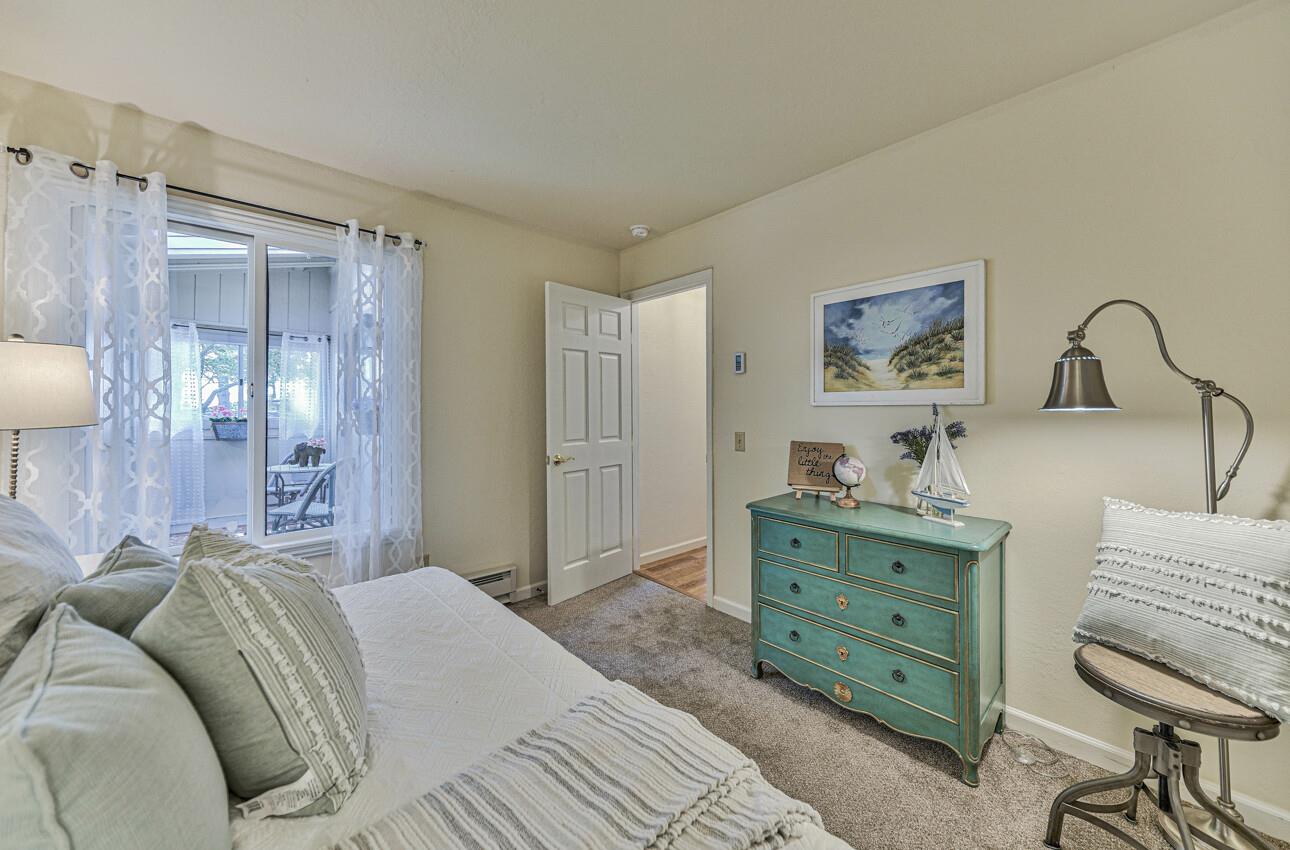 250 Forest Ridge Road, Unit 64 Monterey, CA 93940 - Photo 27 of 35 a bedroom with a bed and a dresser