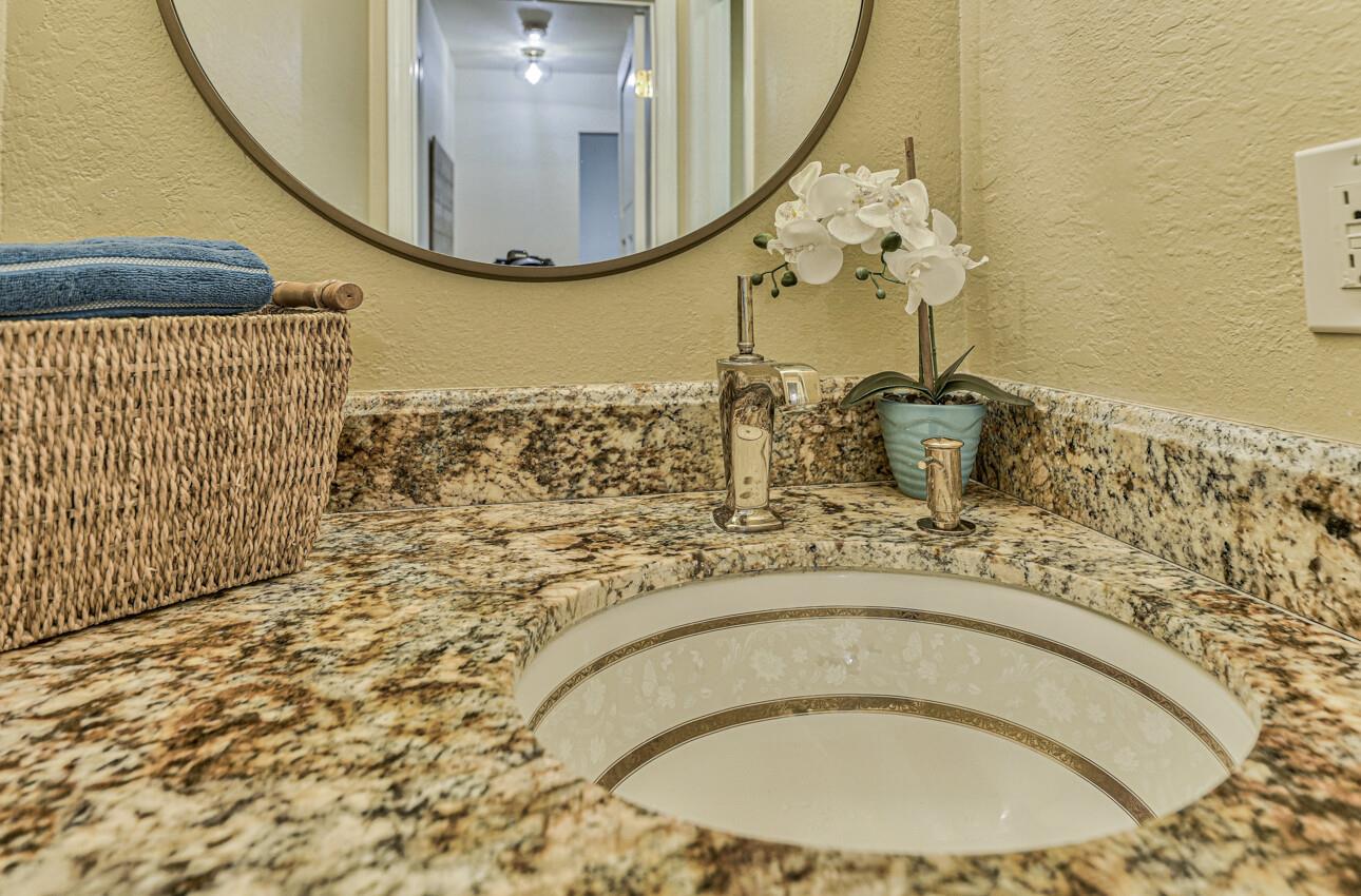 250 Forest Ridge Road, Unit 64 Monterey, CA 93940 - Photo 29 of 35 a bathroom with a sink and a mirror