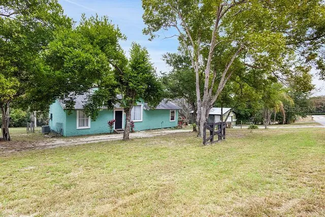 a house with trees in front of it