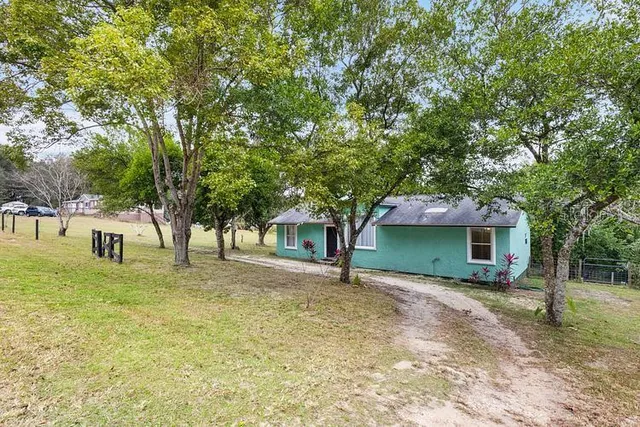 a house with trees in front of it