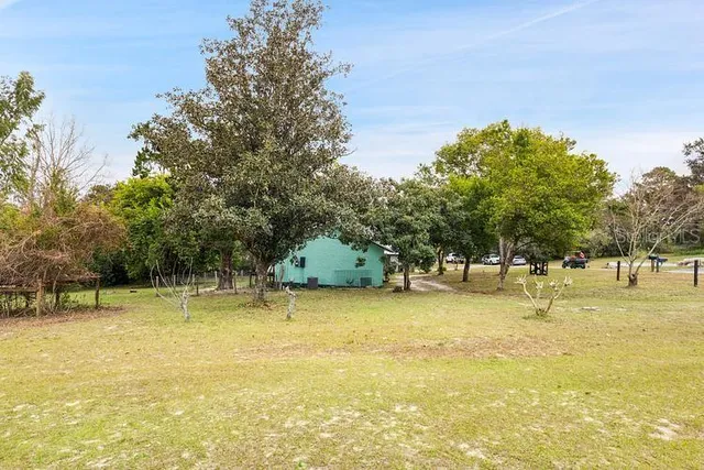 a view of a swimming pool with an outdoor space and seating area