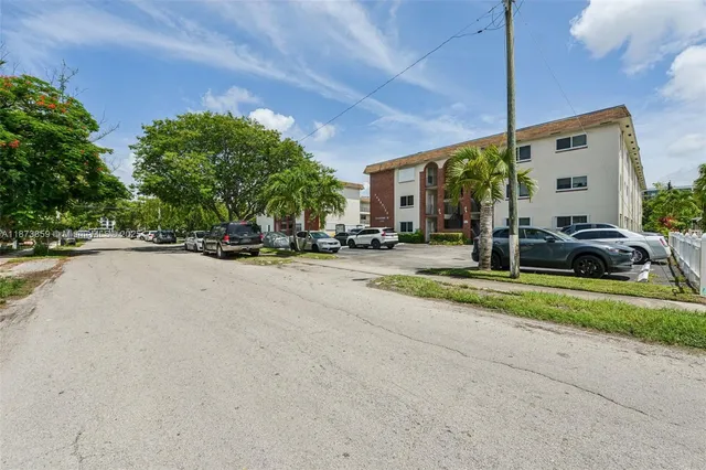 a view of road with card parked